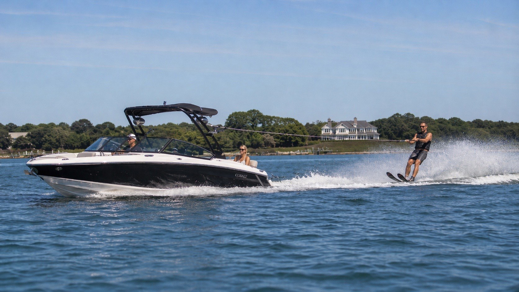 Watersports boat and skier in Sag Harbor area waters for Hamptons boat detailing FAQ guidance